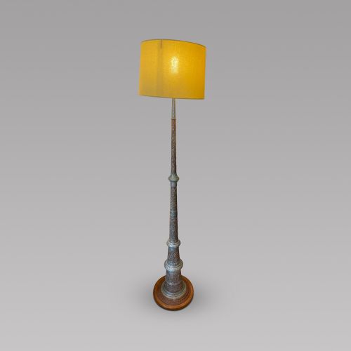 A Eastern Embossed Copper and Silvered Lamp