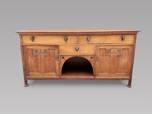 An Arts and Crafts Large Oak Sideboard