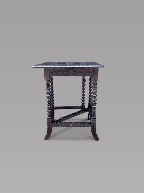 A Carved Ebonised Gateleg Table