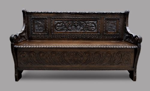 A Victorian Carved Oak Monks Bench or Settle