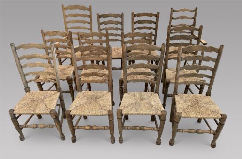 A Harlequin Set of Twelve Ladder Back Armchairs
