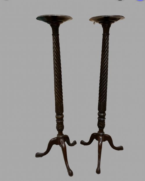 A Pair of Mahogany Torchieres
