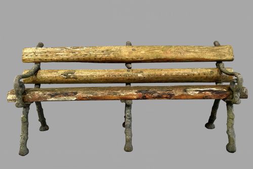 An Iron and Wooden Log Garden Seat