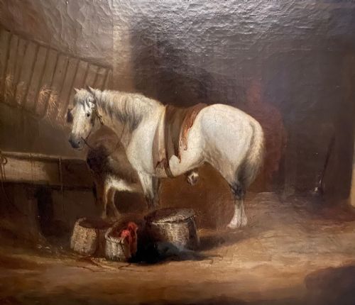 fig 2. An antique oil painting depicting a white horse inside a stable, framed in an ornate gilded wood frame.