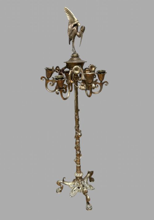 fig 2. Set of ornate 19th-century French gilt bronze candelabra featuring foliate stems, scrolled arms, tripod bases, and detailed bird finials.