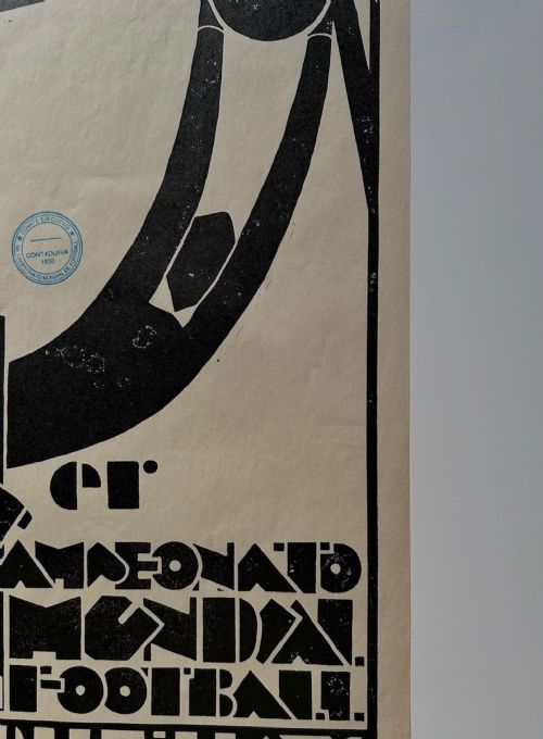 fig 6. A vertical monochrome Art Deco graphic poster featuring a stylised goalkeeper reaching for a ball above dynamic Spanish text for the 1930 World Cup in Uruguay.