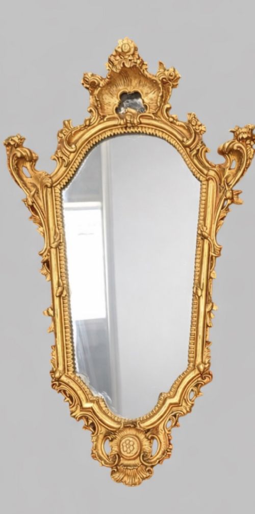 fig 1. A pair of early twentieth-century giltwood wall mirrors crafted in the Louis XV manner with carved rocaille crestings, asymmetrical C-scroll borders, and shaped glass plates.