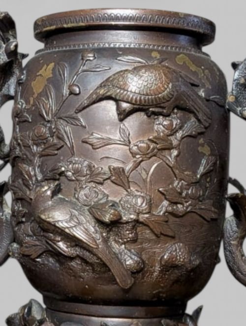 fig 6. An antique cast bronze Japanese incense burner featuring a goat finial, foliage handles, bird relief panels, and a stepped circular base.