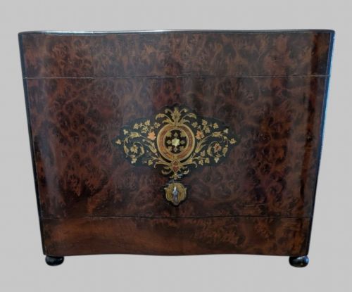 fig 1. An open 19th-century French Napoleon III wooden cave a liqueur box featuring inlaid lid detailing and a removable tier holding cut-glass decanters and small glasses.
