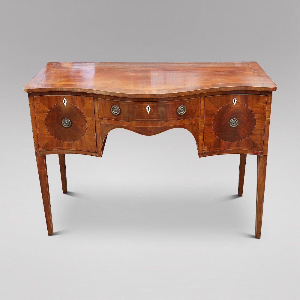 A Regency mahogany serpentine fronted sideboard