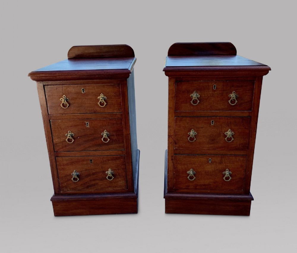 A Pair of Three Drawer Mahogany Bedside Tables