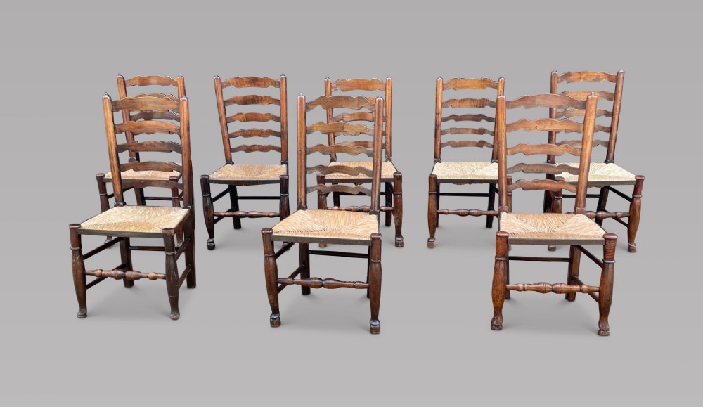 A Set of c1900 Eight Ladder-back Chairs