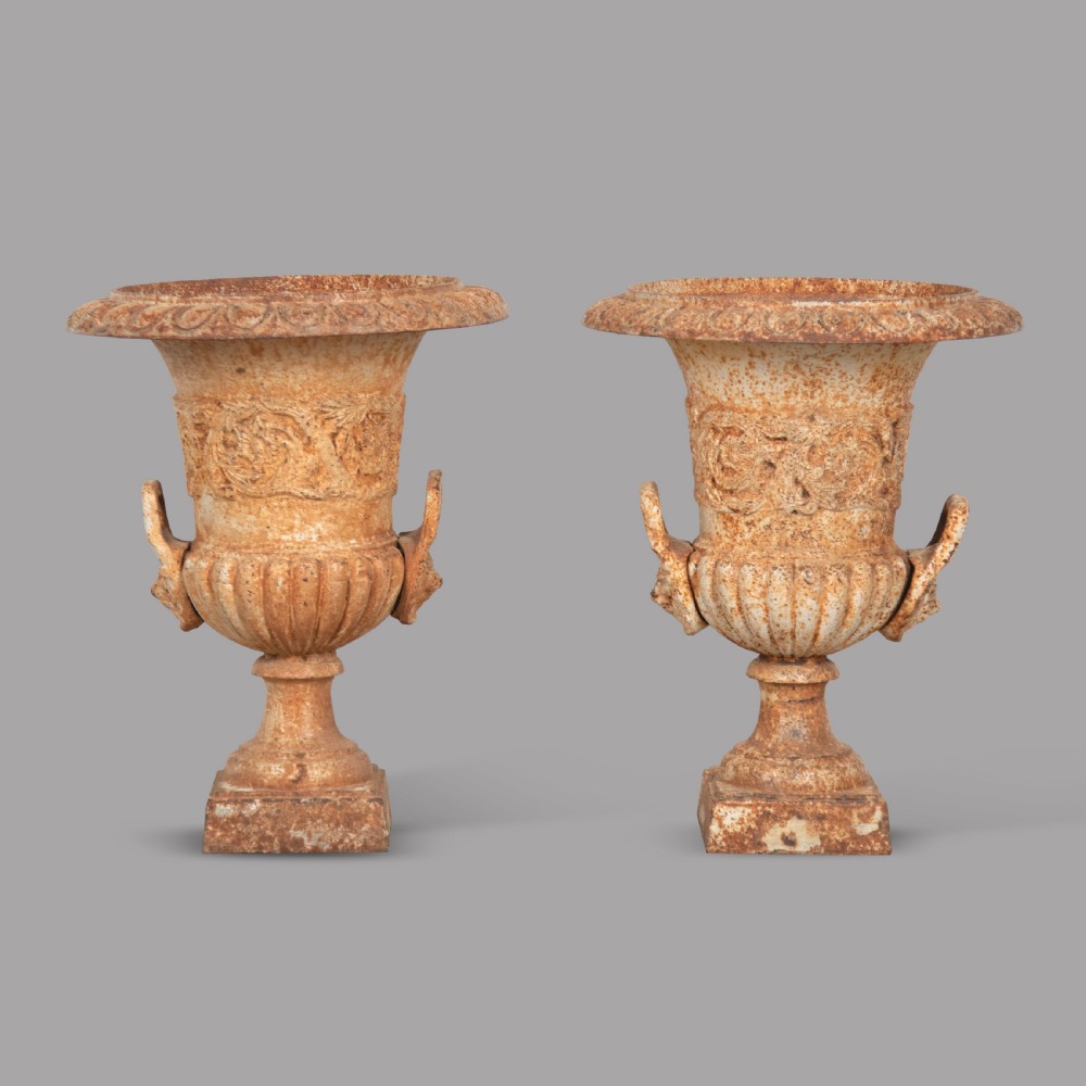 A Pair of Cast Iron Urns