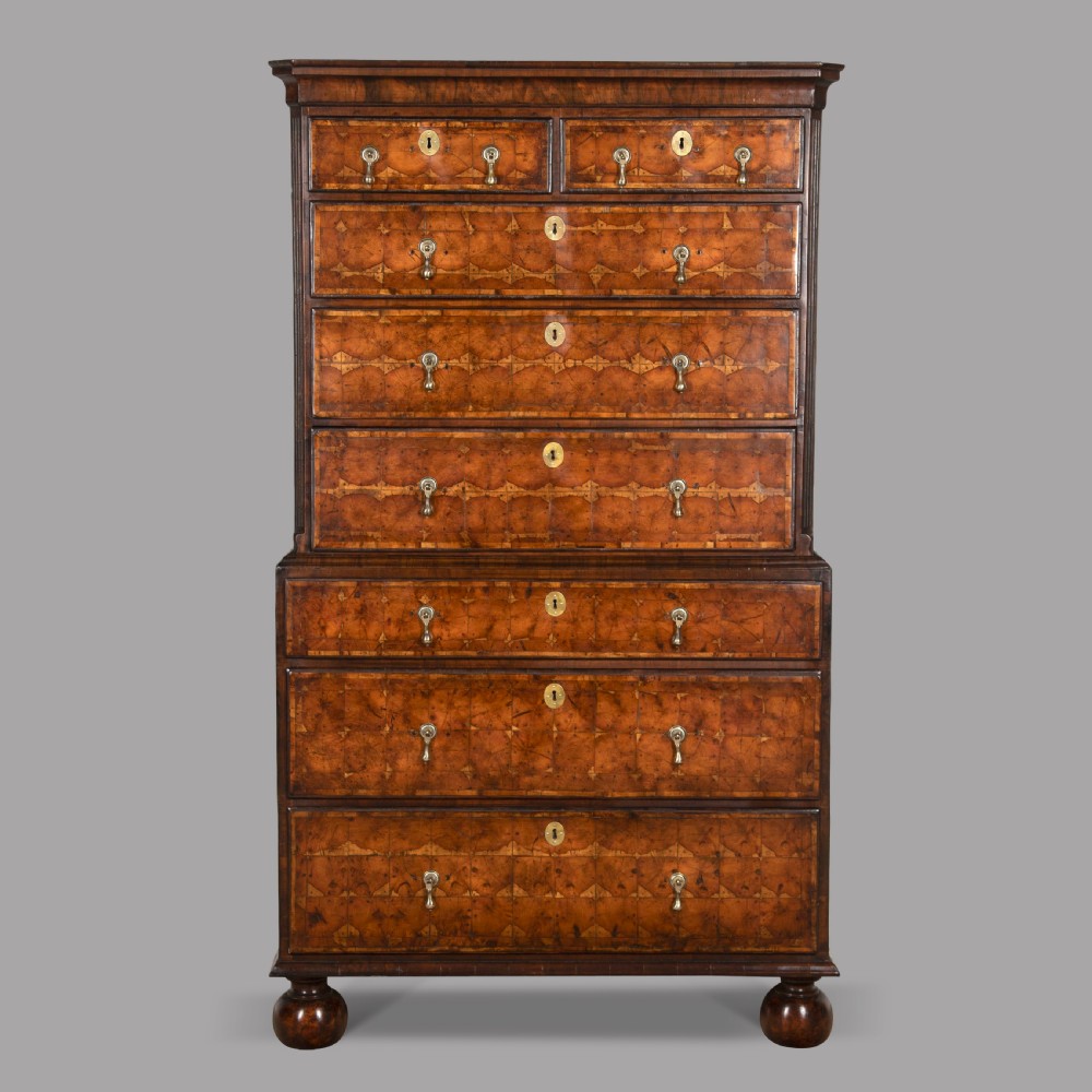 A Walnut and Yew Wood Oyster Chest on Chest