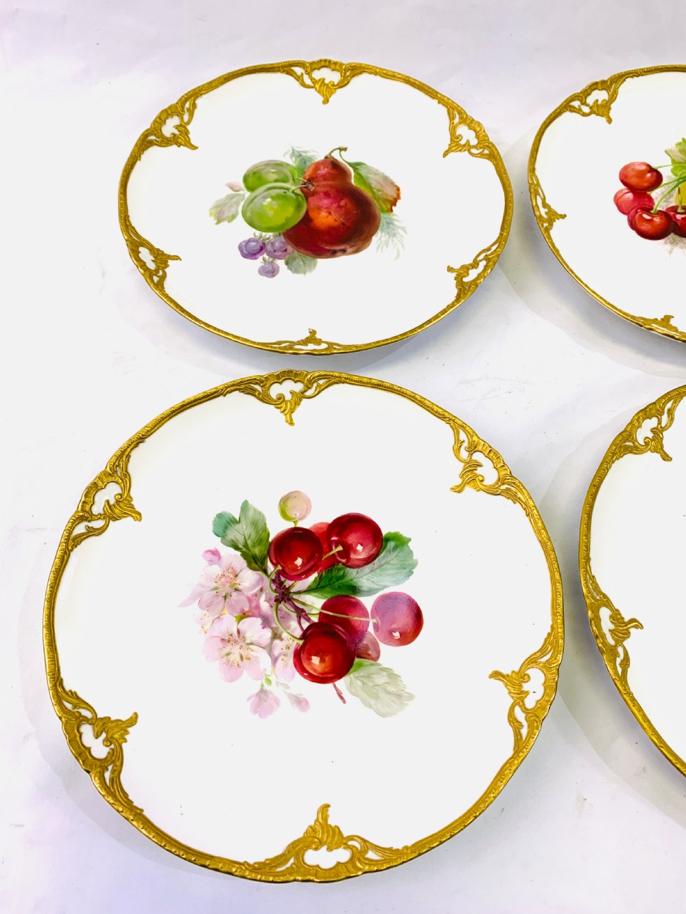 A set of six K.P.M cabinet plates decorated with fruit and gilt border View II