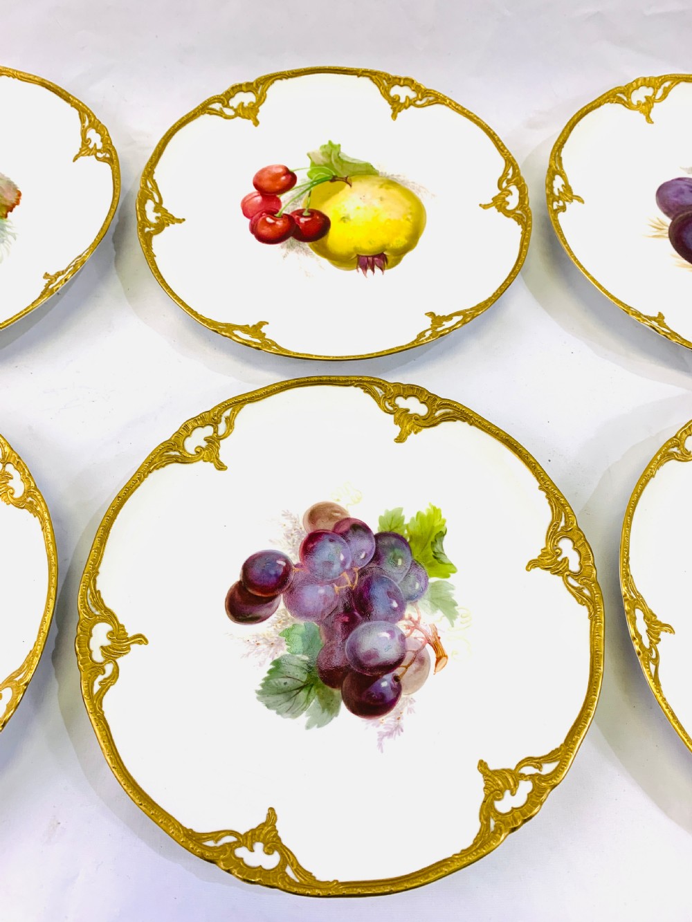 A set of six K.P.M cabinet plates decorated with fruit and gilt border View III