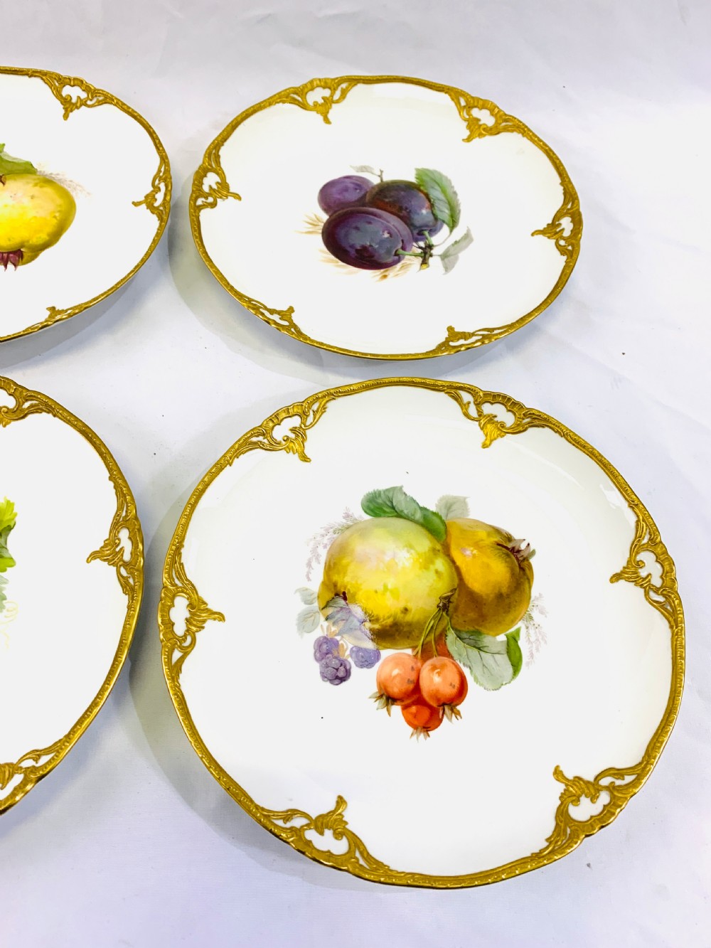 A set of six K.P.M cabinet plates decorated with fruit and gilt border View IV