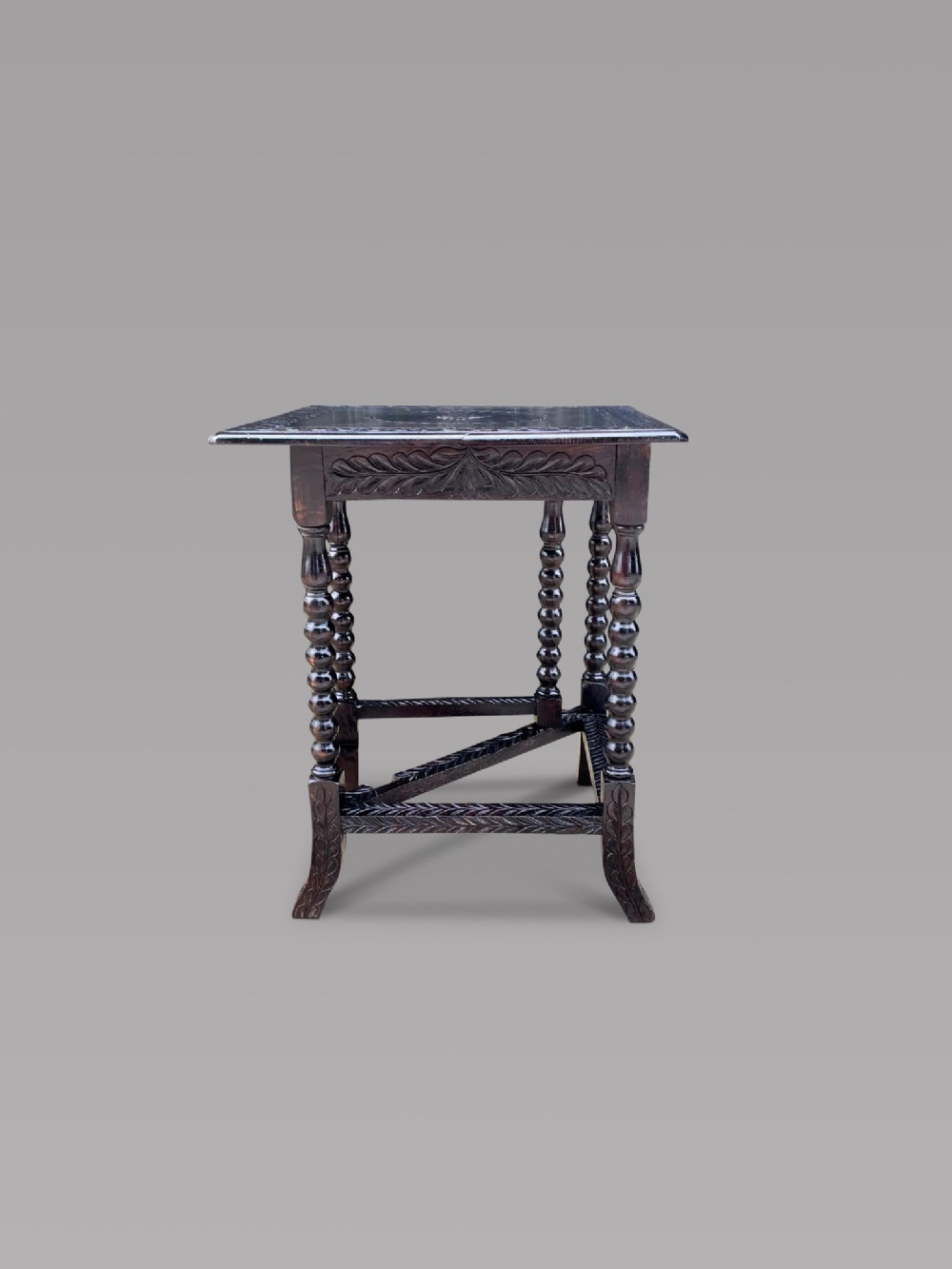 A Carved Ebonised Gateleg Table