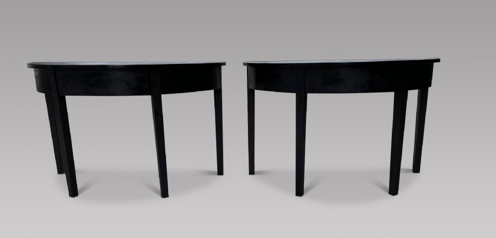 A Pair of Late Georgian Ebonised Console Tables