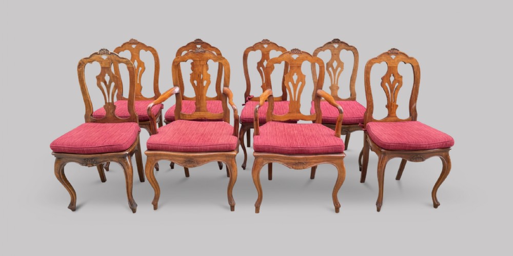 A Set of Eight French Fruitwood Dining Chairs