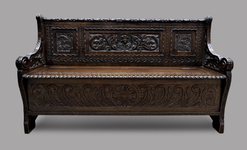 A Victorian Carved Oak Monks Bench or Settle