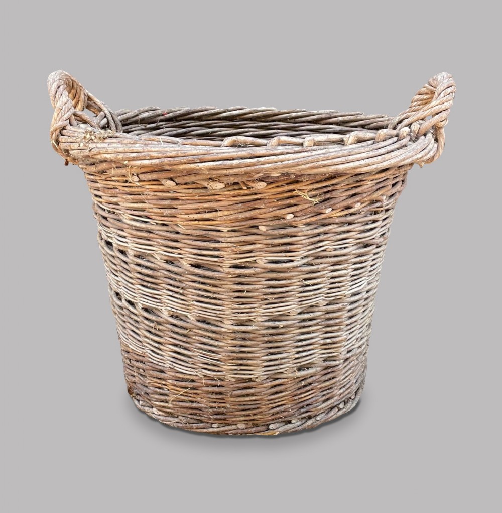 A Large Round Wicker Basket with handles