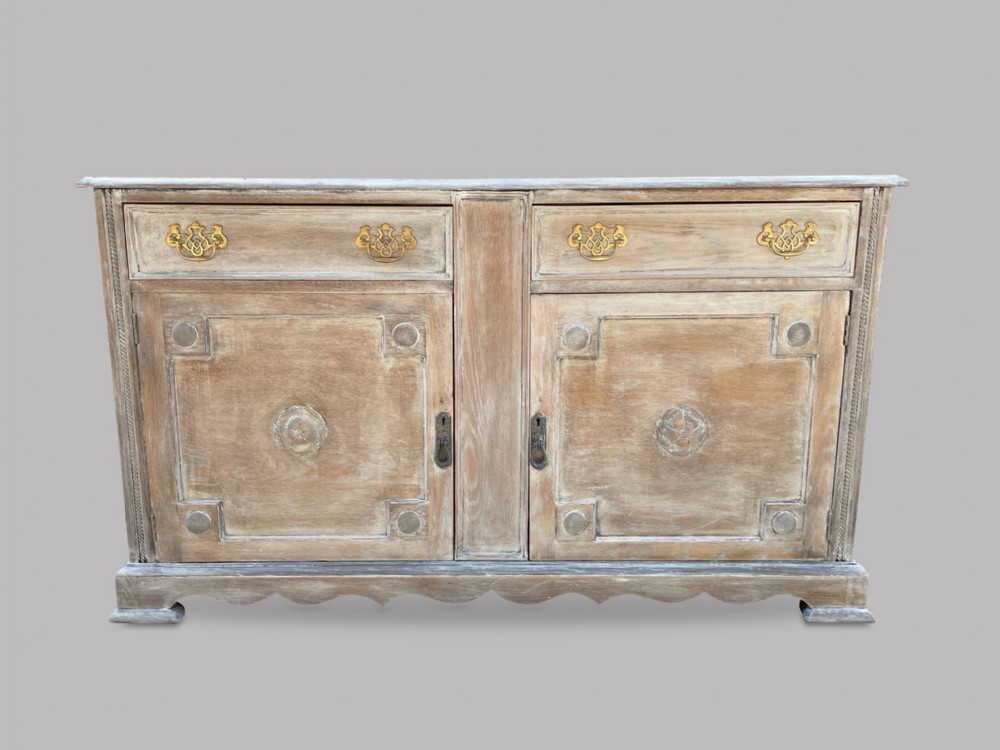 An Arts and Crafts Stripped And Limed Oak Dresser Base