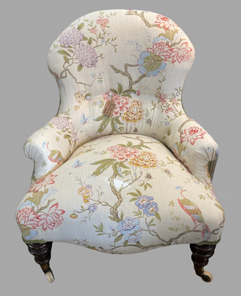 An Iron Framed Re upholstered Nursing Chair