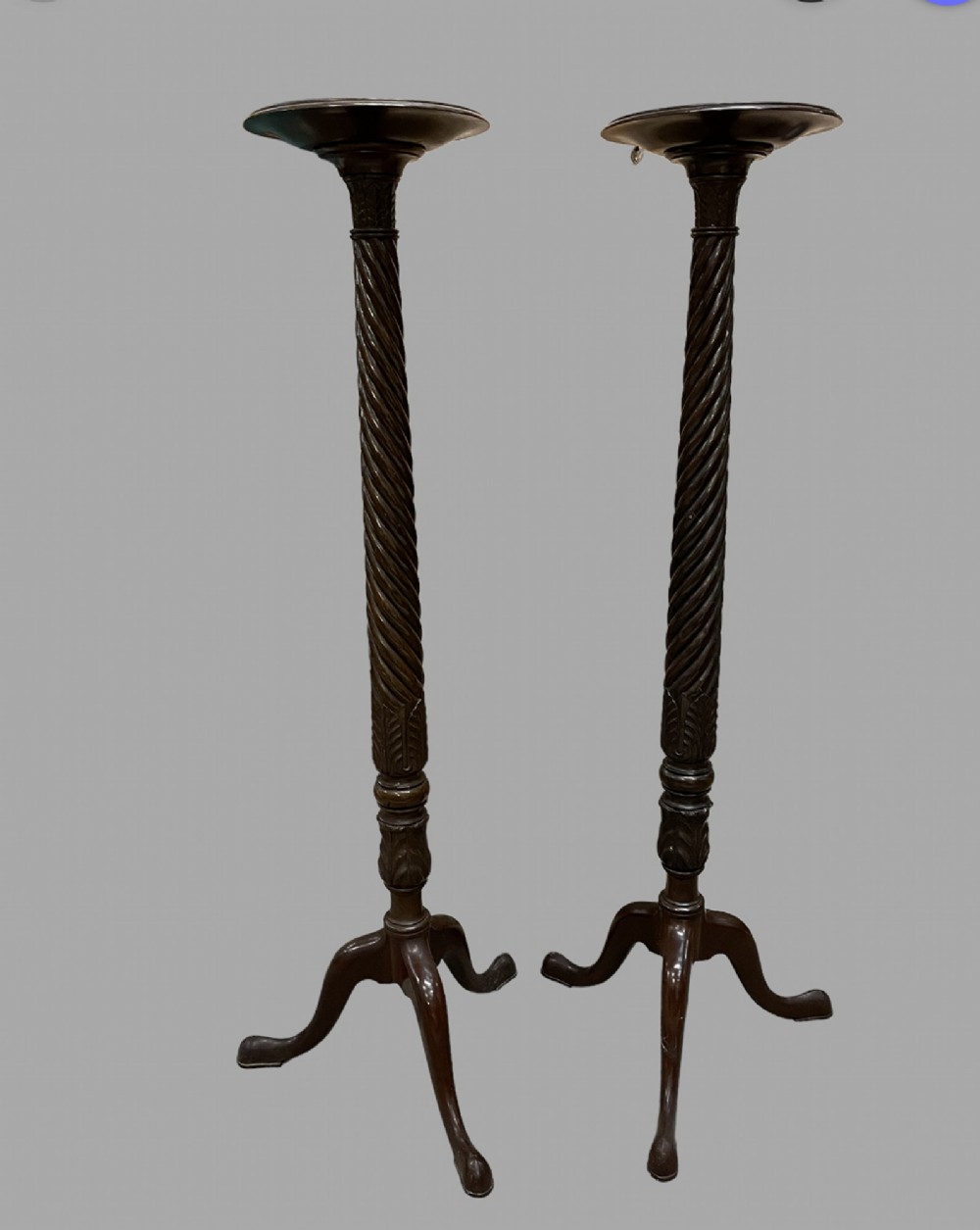 A Pair of Mahogany Torchieres