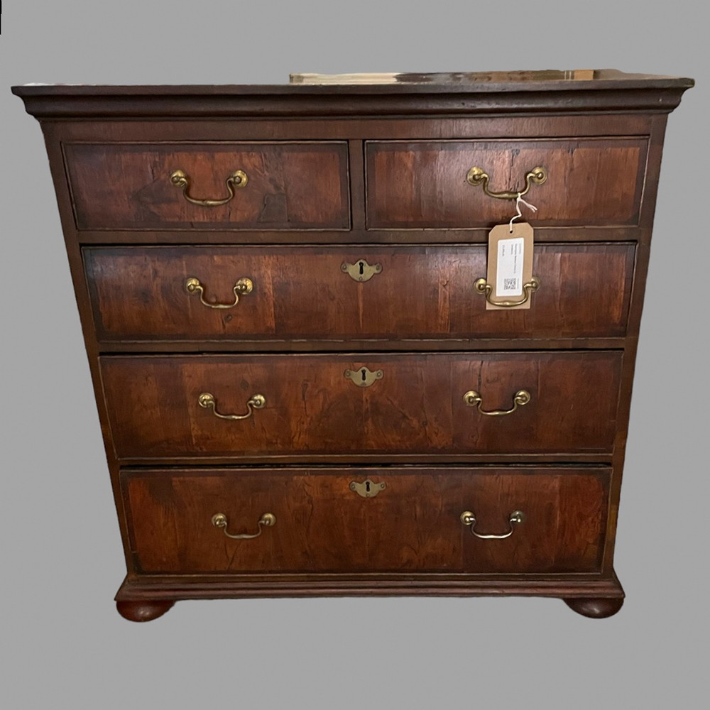 A Georgian Walnut Chest of Drawers