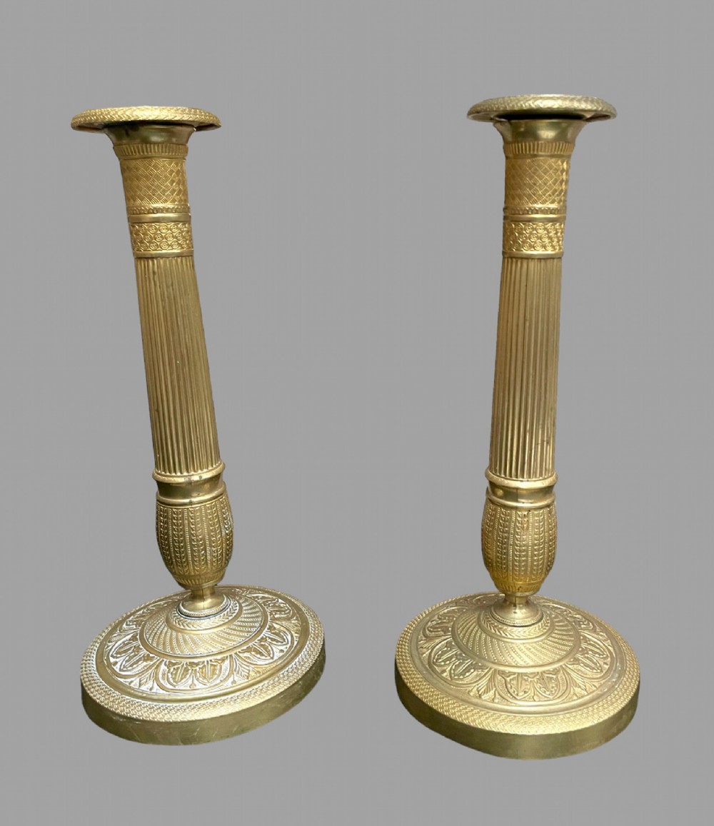 A Pair of French Gilt Brass Empire Candlesticks