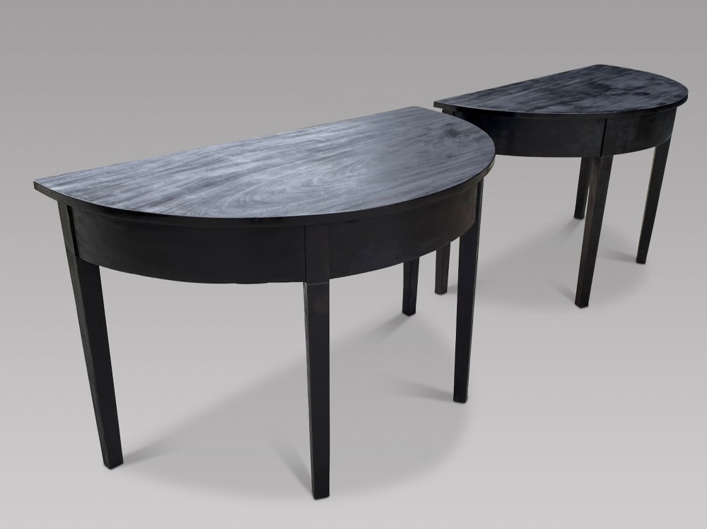 A Pair of Late Georgian Ebonised Console Tables