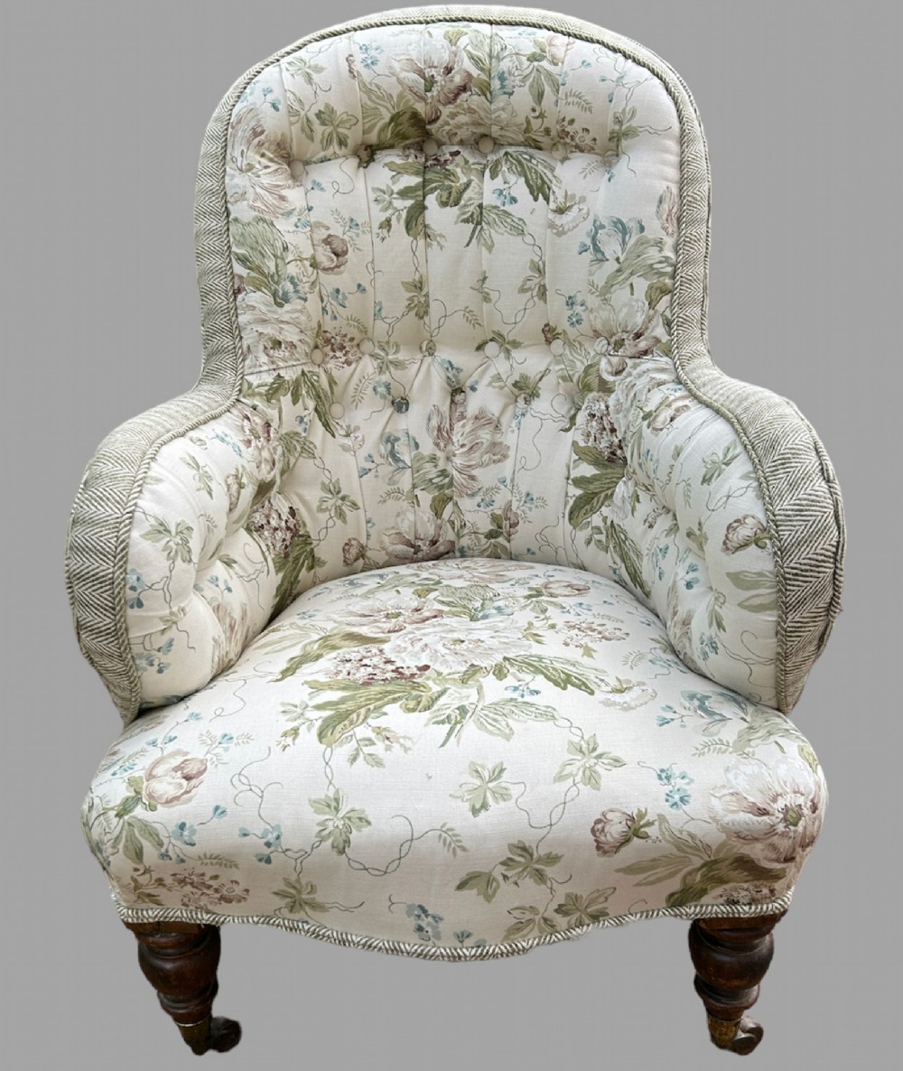 An Iron Framed Victorian Button Back Armchair