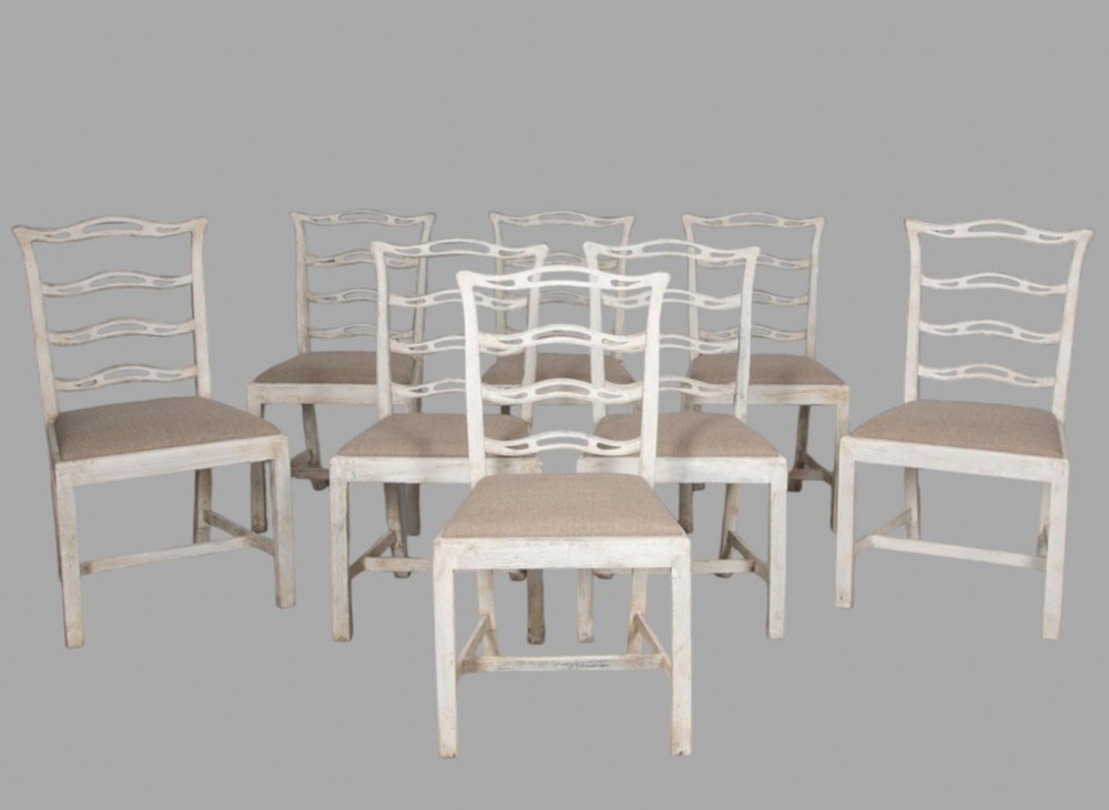 A Set of Eight Painted Ladderback Chairs (2 Carvers,6 Singles)