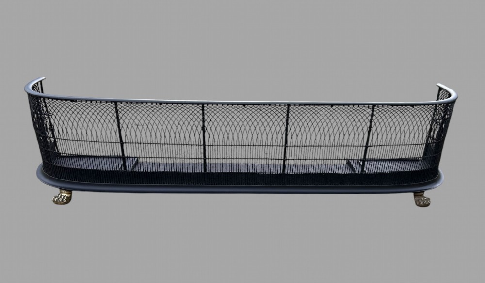 A Black Steel and Brass Fender