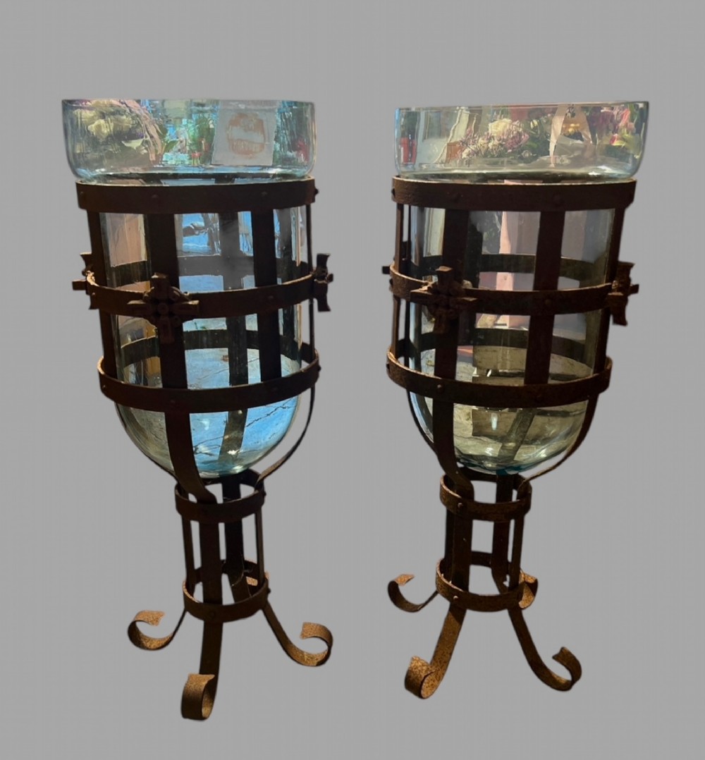A Pair of Wrought Iron Hurricane Lanterns