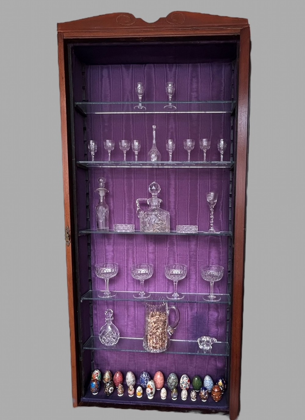 A Wall Hanging Cabinet with Glass Shelving (items not included)