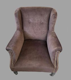 AN EDWARDIAN WING ARMCHAIR