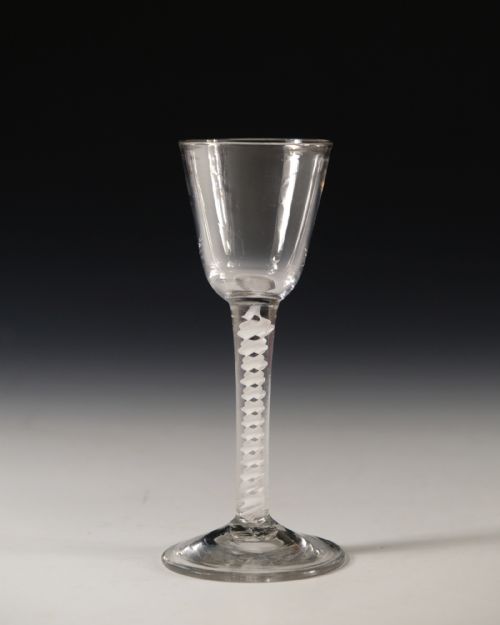 DOUBLE SERIES OPAQUE TWIST WINE GLASS ENGLISH C1765BOWL DIA 58CM FOOT DIA 7 CM CONDITION VERY GOOD WITH NO CHIPS CRACKS OR EVIDENCE OF RESTORATIONANTIQUE GLASS OPAQUE TWIST WINE GLASS ENGLISH C1765 - ADDITIONAL PHOTO 1