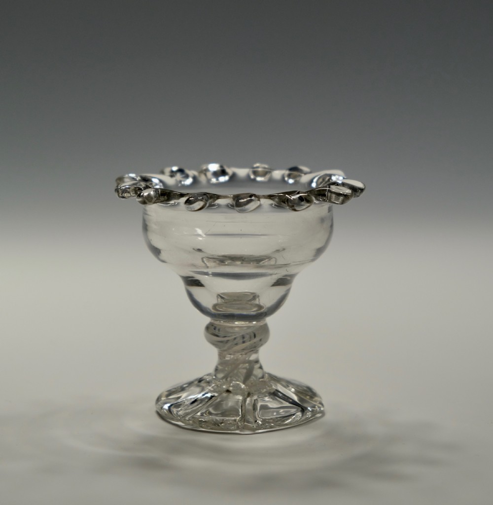 Small opaque twist sweetmeat glass with 'dogs tooth' border English C1765