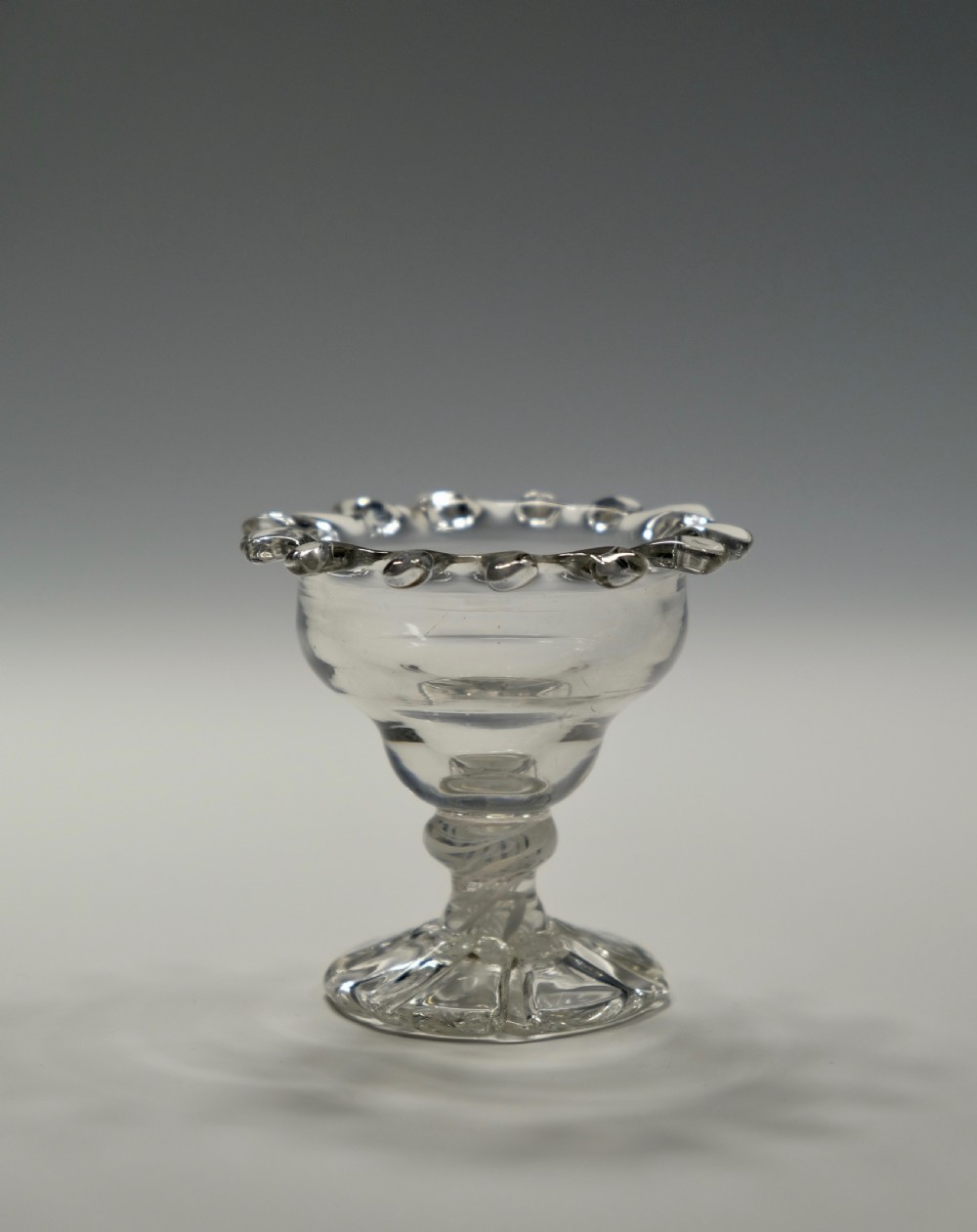 Small opaque twist sweetmeat glass with 'dogs tooth' border English C1765 View II