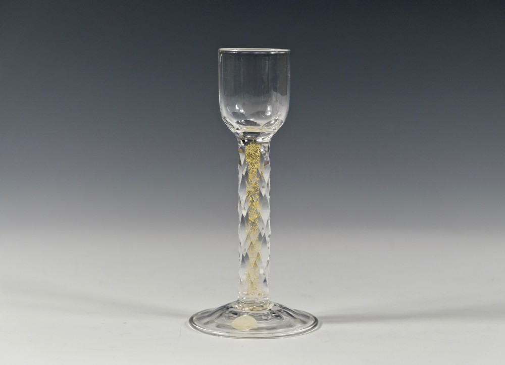 Liqueur glass the facet cut stem with gold foil inclusions C1900