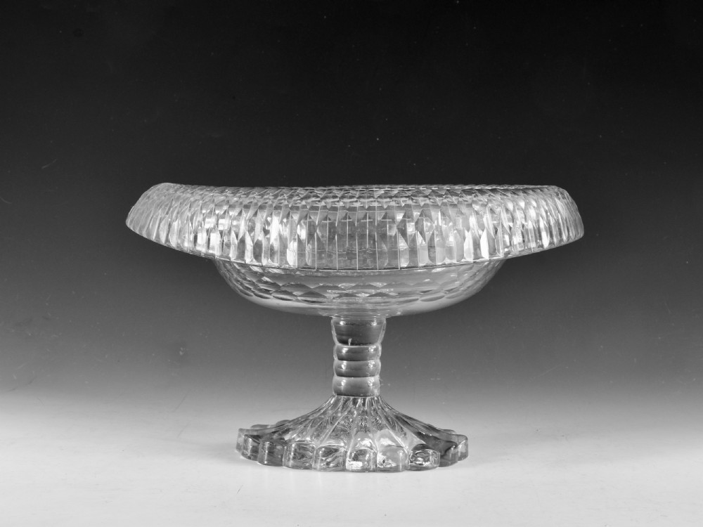 A late 18th-century clear cut glass pedestal bowl with a wide folded turnover rim, diamond cutting, and a heavy moulded foot. View II