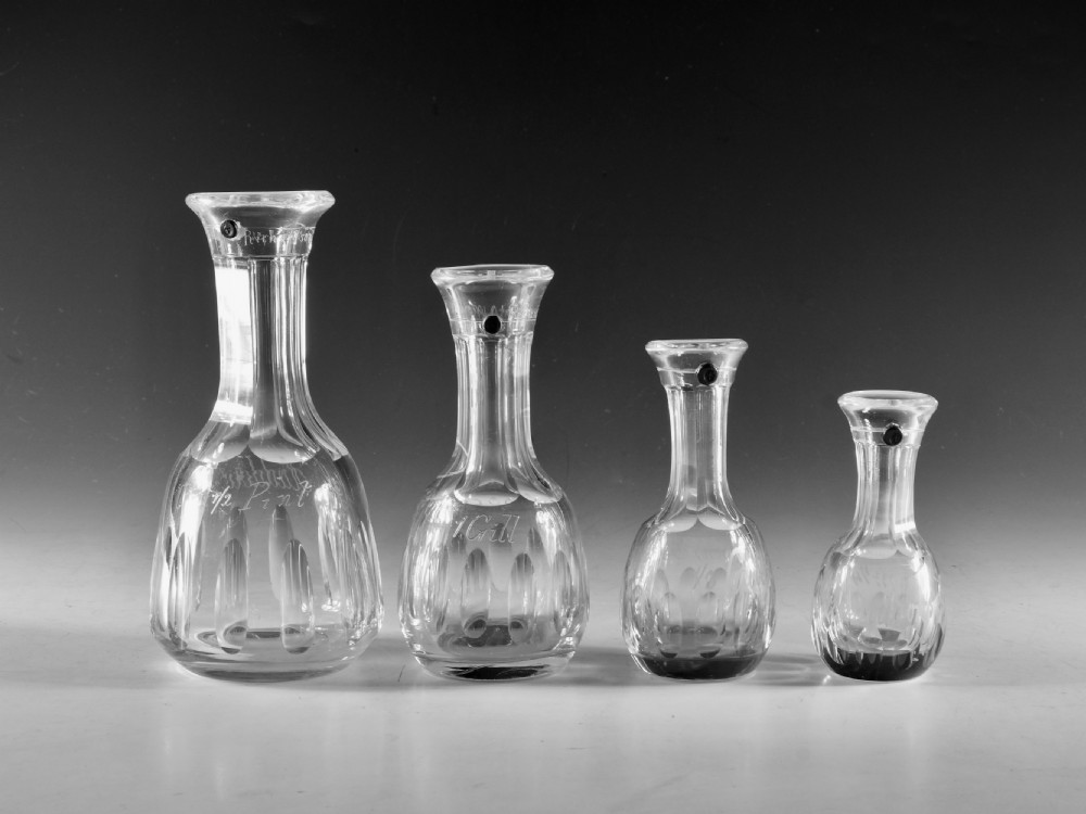 Antique glass set of four spirit measure English 1869