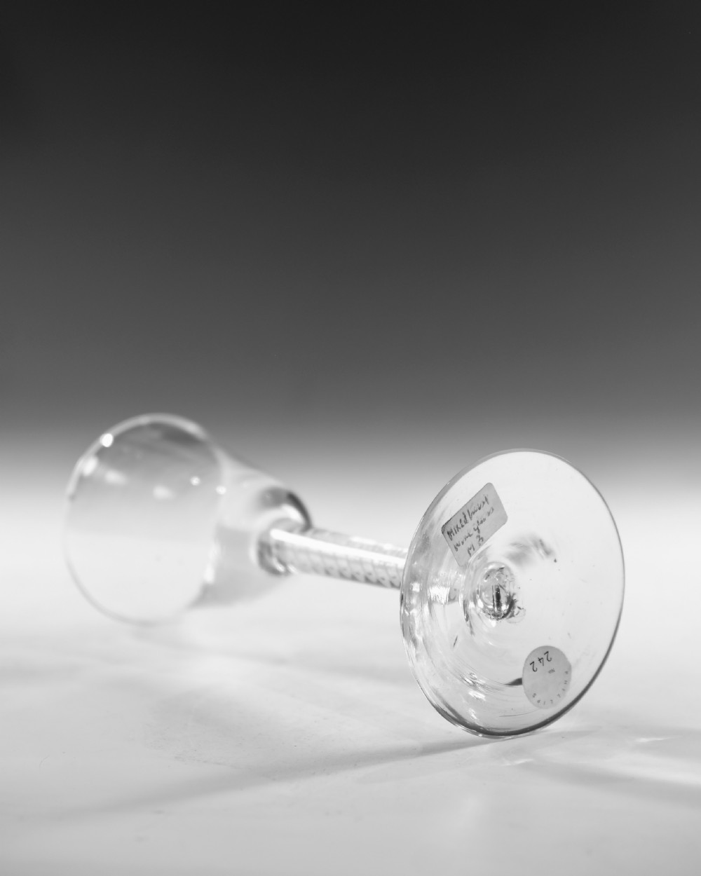 A clear Georgian lead crystal wine glass featuring a bell-shaped bowl, a mixed twist stem, and a circular conical foot. View III