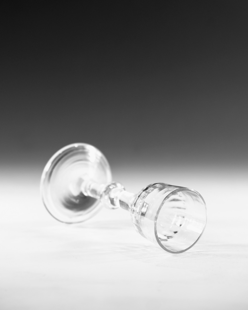 A clear Georgian balustroid wine glass featuring a stem with a central knop resting on a circular foot. View IV