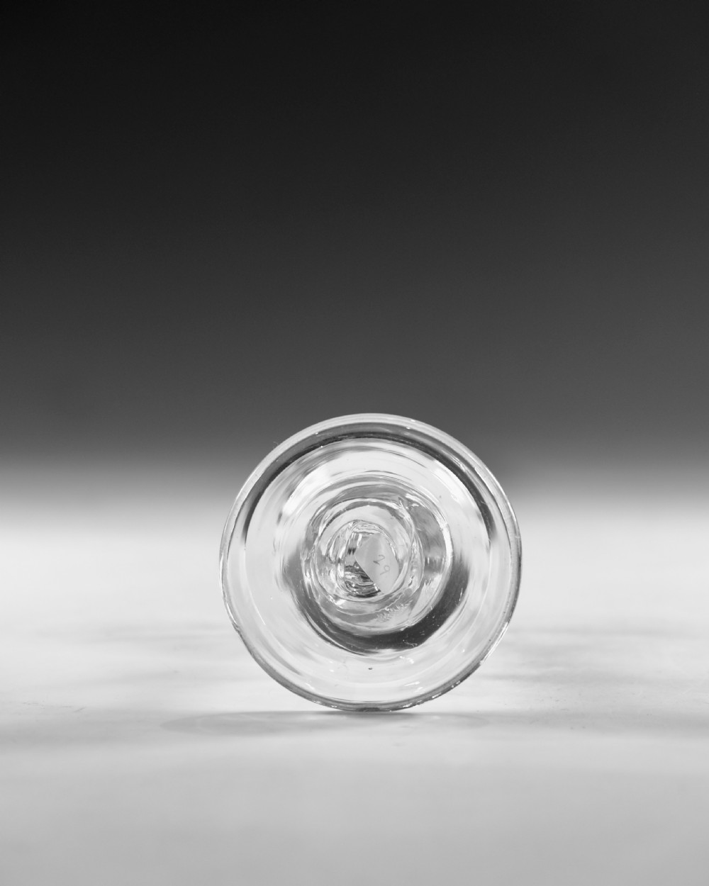 A clear Georgian balustroid wine glass featuring a stem with a central knop resting on a circular foot. View V