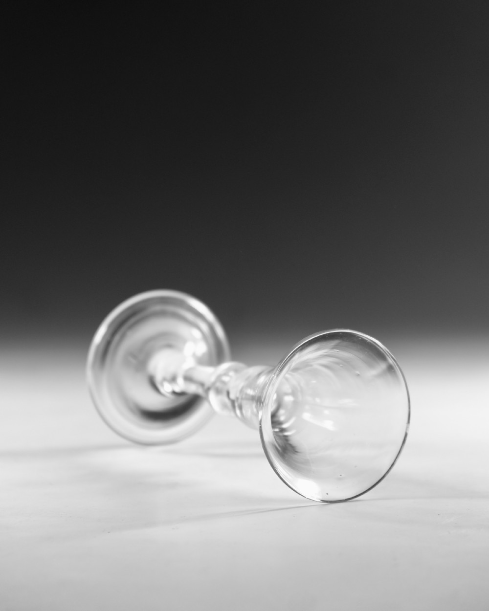 A Georgian clear glass wine glass featuring a flared bell bowl, a knopped stem, and a circular conical foot. View IV
