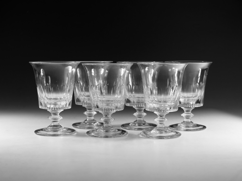 A set of six English Georgian clear glass rummers with cut fluted bowls and knopped stems on circular bases. View II