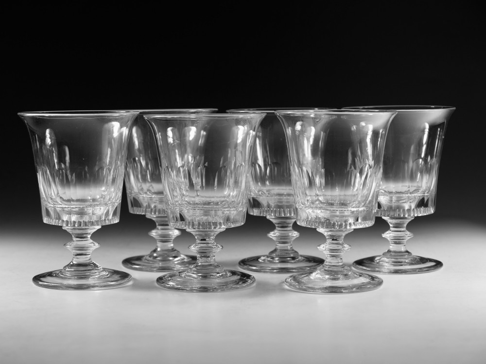 A set of six English Georgian clear glass rummers with cut fluted bowls and knopped stems on circular bases. View III